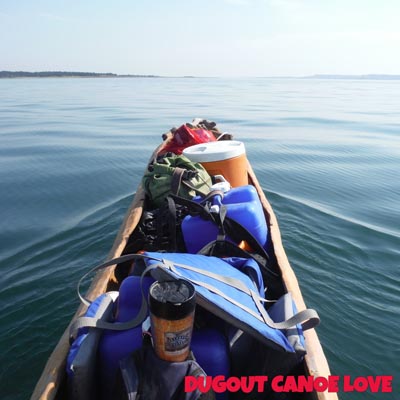 Paddling a dugout canoe.