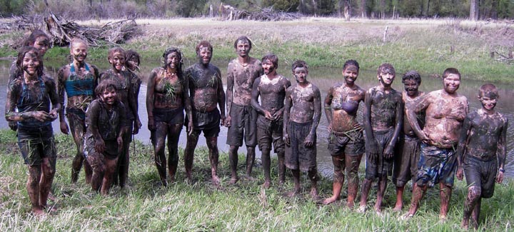 Students with mud camouflage.