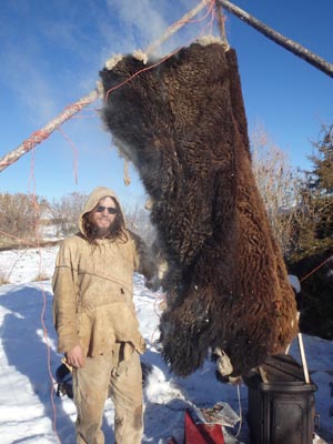 Smoking a braintanned bison hide buffalo robe.