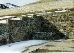 Slipform Stone Masonry retaining wall.