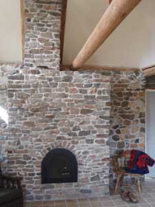 A masonry fireplace built by students.