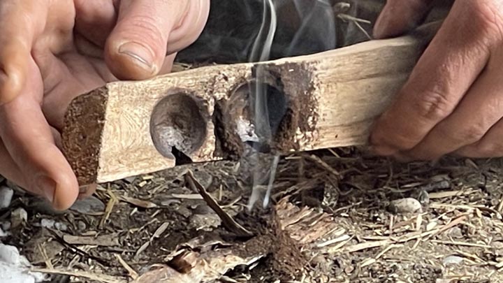 Bowdrill coal: A burning ember from friction fire.